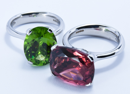 Four claw platinum and white gold cocktail rings with peridot and tourmaline