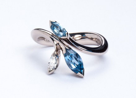 Floral platinum ring with Marquise cut aquamarines and diamond 