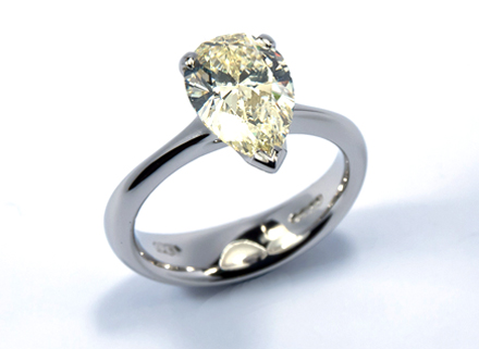 Four claw platinum ring with a pear cut diamond