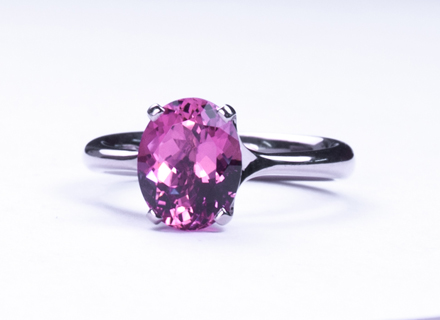 Four claw 18ct white gold ring with a oval cut pink tourmaline
