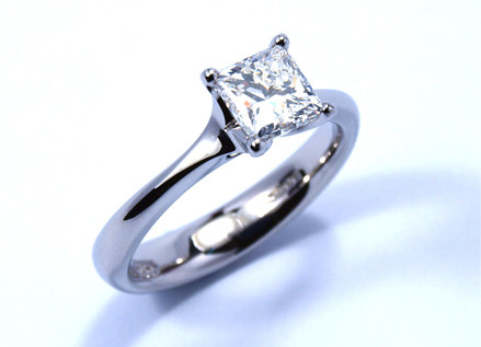 Four claw platinum ring with a princess cut diamond
