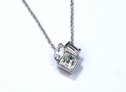 Diamond platinum ROMD pendant