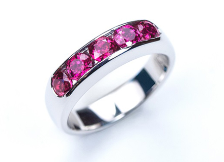 Platinum channel set eternity ring with rubies