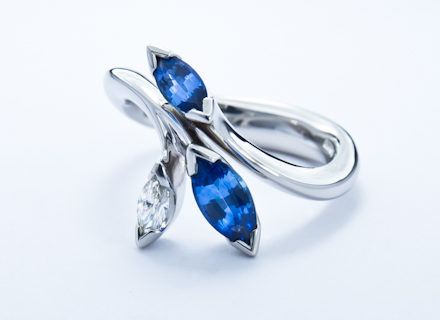 Floral platinum ring with marquise cut diamond and sapphires